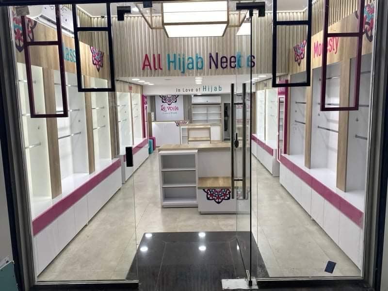 Backlit mirror and magenta banding, Equal's stand for All Hijab Needs