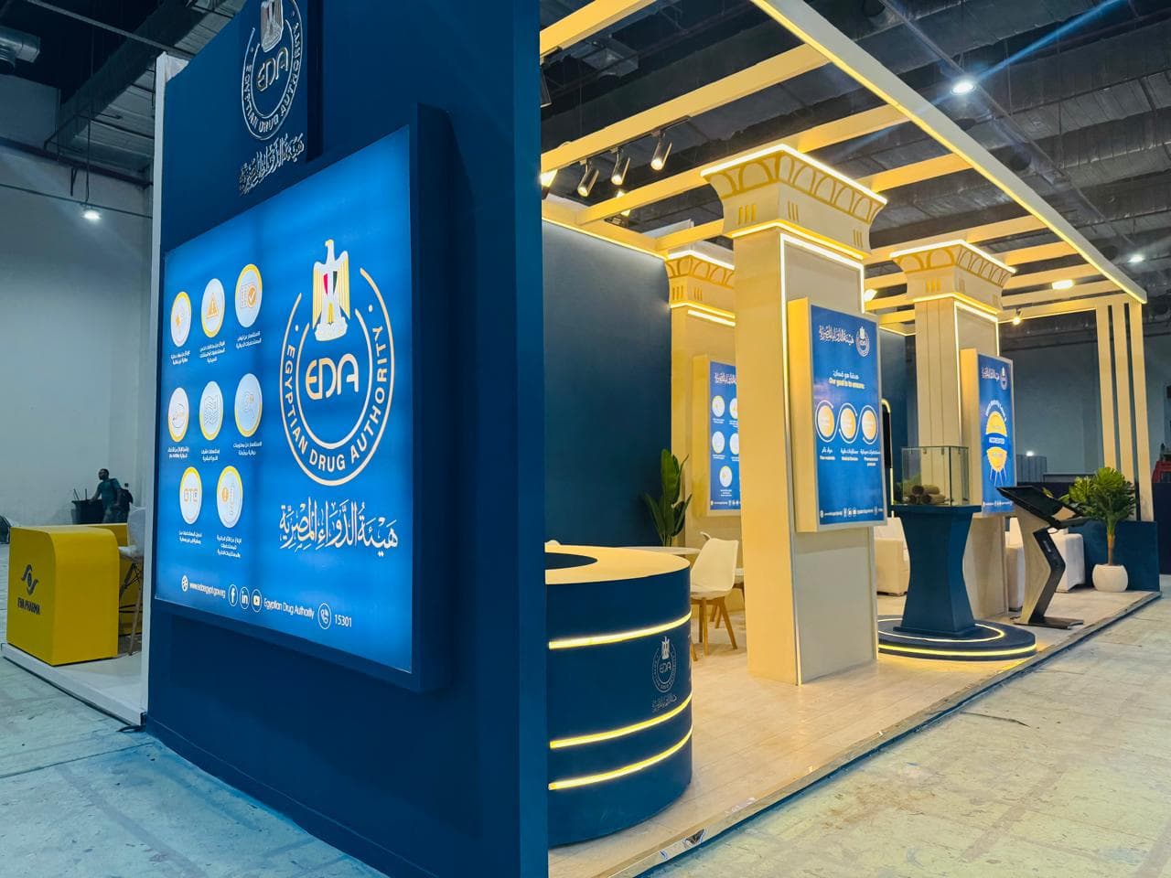 Curved illuminated reception desk, Equal's stand for Egyptian Drug Authority